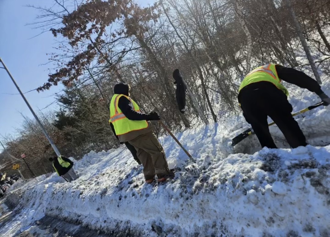 Team shoveling snow